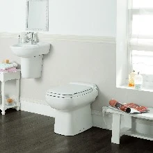 SFA Sanicompact Luxe staand toilet met ingebouwde vergruizer - met zitting - wit